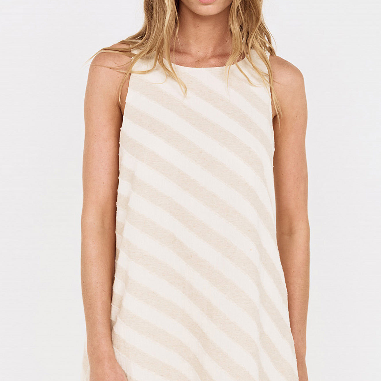 Cotton Linen Blend Mini Dress with Shell Detail worn by a model in a light striped pattern.