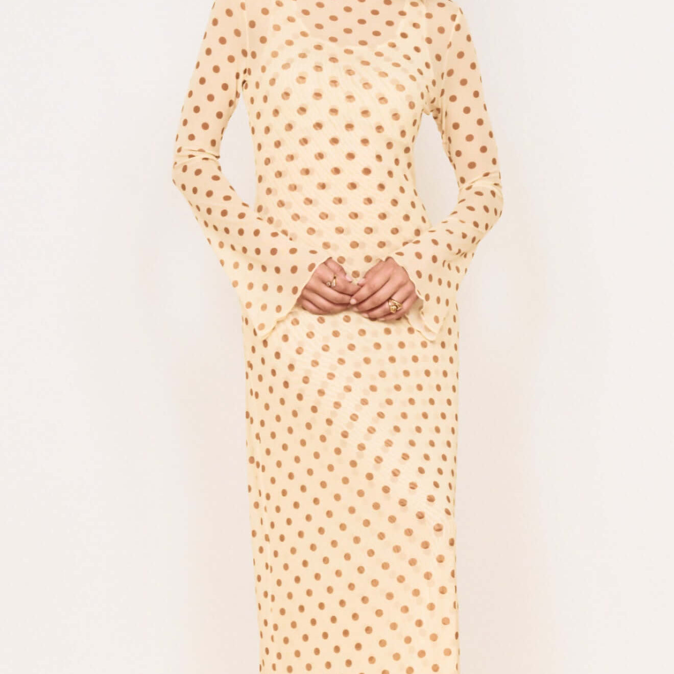 Butter Yellow Polka Dot Midi Dress featuring a boat neckline and flared sleeves in a lightweight fabric.