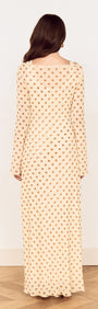 Back view of the Butter Yellow Polka Dot Midi Dress showcasing its layered design and flared sleeves.
