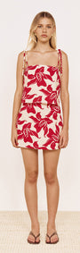 Cotton A-Line Mini Skirt in Red Floral, featuring bold floral print and A-line silhouette on model.