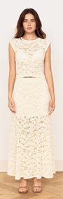 Woman wearing a Cream Cotton Lace Maxi Skirt paired with a matching lace top, showcasing a romantic, elegant style.