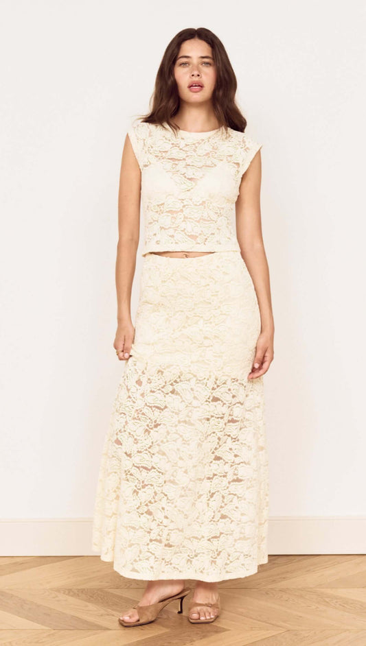 Model wearing Cream Cotton Lace Maxi Skirt with matching lace top in a stylish pose, showcasing elegant floral lace design.