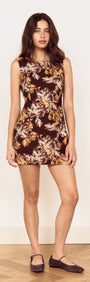Brown Floral Tie Back Shift Dress on model with a vintage floral print in warm earthy tones.