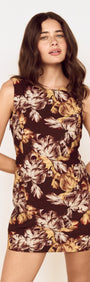 Brown Floral Tie Back Shift Dress worn by model, showcasing a fitted mini silhouette with floral print.