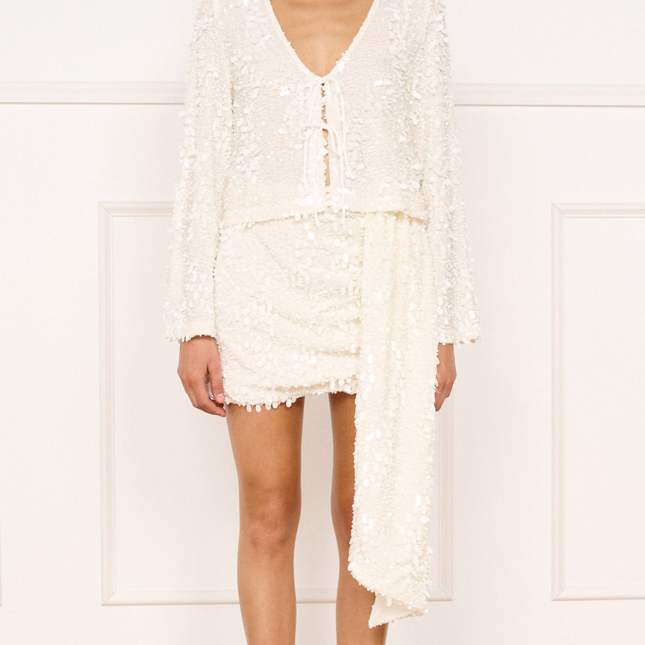 Model wearing Sash Detail Sequin Mini Skirt in Cream with a matching sequin top.