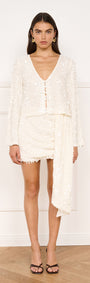 Model wearing Sash Detail Sequin Mini Skirt in Cream with a matching sequin top.