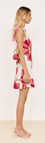 Pink Floral Bias Mini Dress with Scoop Back shown on model from the side, featuring bold pink floral print on ivory.