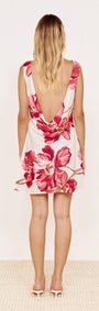 Pink Floral Bias Mini Dress with Scoop Back, showing back view with low draped cowl back and bold floral print.
