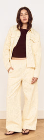 Cotton Denim Broderie Anglaise Jacket worn with matching bottoms, featuring delicate broderie detailing.