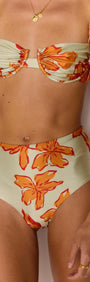 Model wearing the Green & Orange Gathered Bra Top with gathered cups in a floral design.