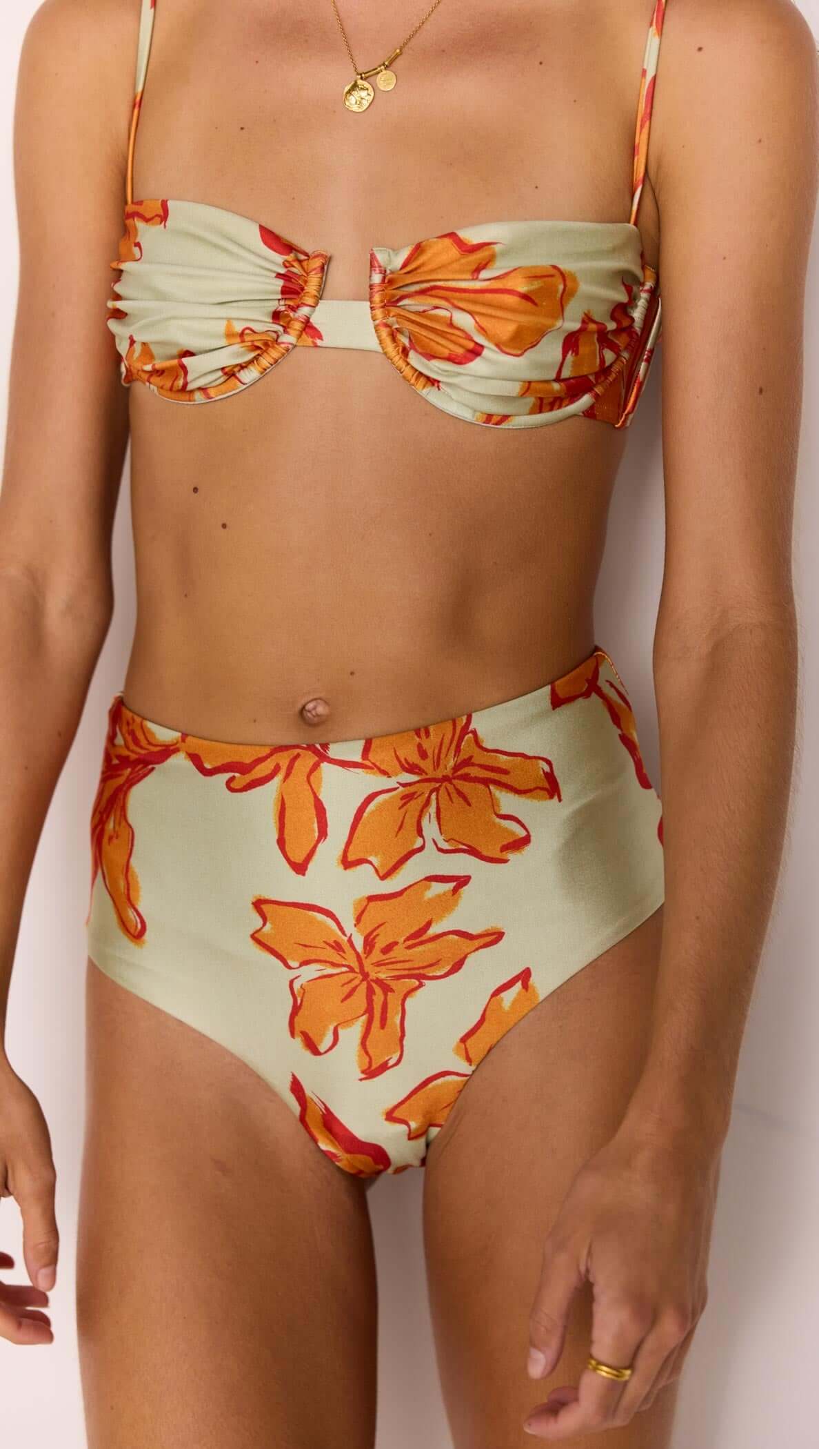 Model wearing the Green & Orange Gathered Bra Top with gathered cups in a floral design.