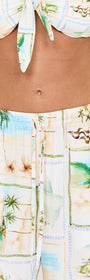 Island Postcard Drawstring Beach Pants featuring a colorful postcard-inspired print and lightweight fabric.