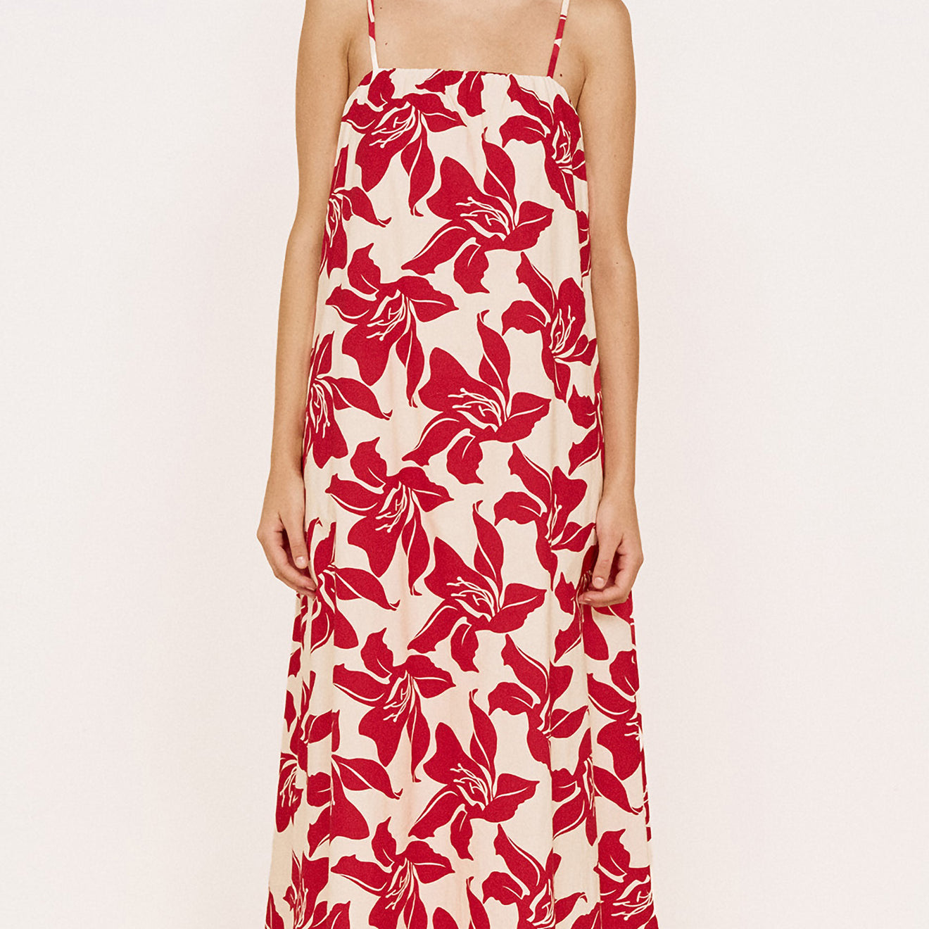 Model wearing a Cotton Maxi Sun Dress in Red Floral with a relaxed fit and adjustable straps.
