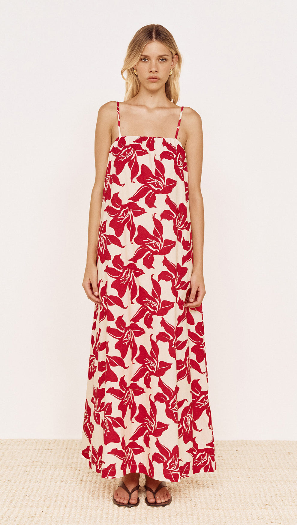 Model wearing a Cotton Maxi Sun Dress in Red Floral with a relaxed fit and adjustable straps.