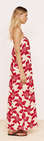 Cotton Maxi Sun Dress in Red Floral worn by a model, showcasing its flowing silhouette and bold floral print.