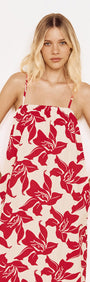 Cotton Maxi Sun Dress in Red Floral worn by a model, featuring a flowing silhouette and bold red floral print.