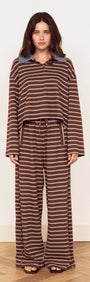 Constrast Collar Striped Jersey Polo Top featuring chocolate stripes and contrast denim collar, styled with relaxed-fit pants.