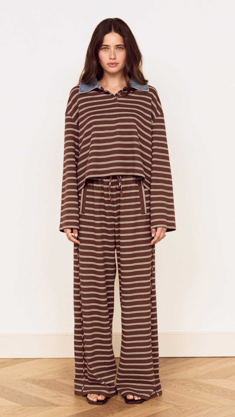 Constrast Collar Striped Jersey Polo Top featuring chocolate stripes and contrast denim collar, styled with relaxed-fit pants.