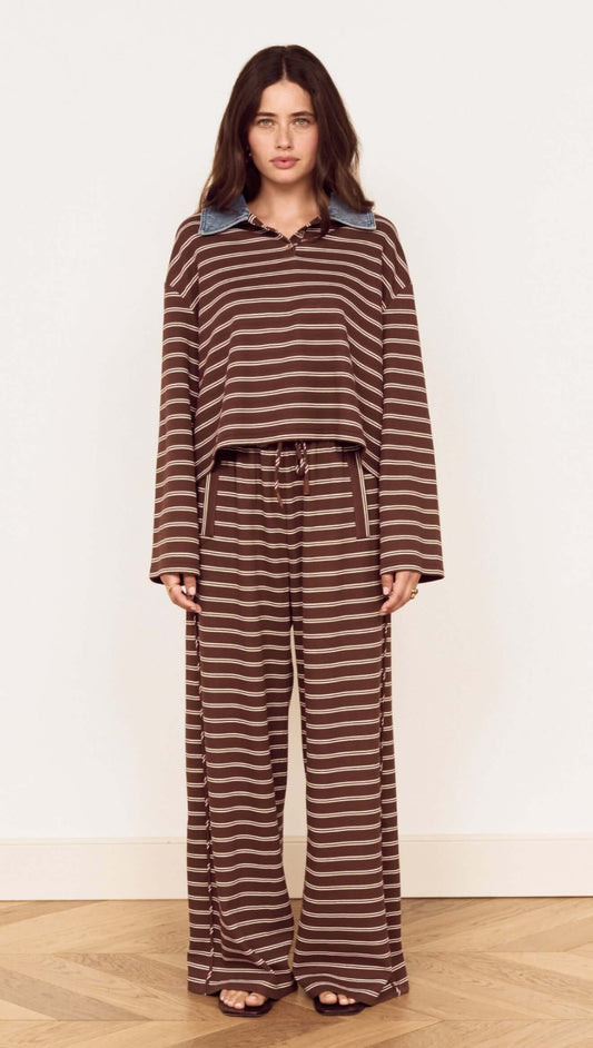 Constrast Collar Striped Jersey Polo Top featuring chocolate stripes and contrast denim collar, styled with relaxed-fit pants.