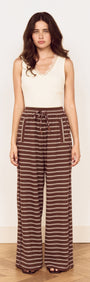Model wearing Stripe Relaxed Drawstring Jersey Pant with a soft stretch fabric and vintage chocolate stripe design.