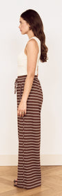 Model wearing Stripe Relaxed Drawstring Jersey Pant in vintage-inspired chocolate stripe design.