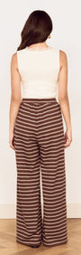Model wearing Stripe Relaxed Drawstring Jersey Pant with a vintage chocolate stripe design from the back.