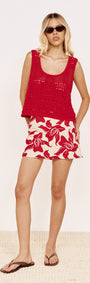 Model wearing Round Neck Crochet Tank in Red, paired with floral shorts and sandals, perfect for summer style.