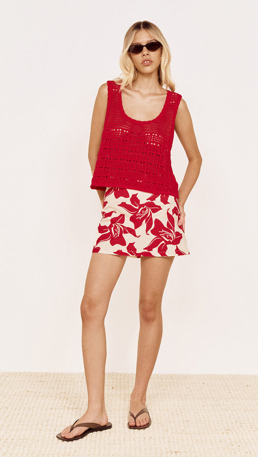 Model wearing Round Neck Crochet Tank in Red, paired with floral shorts and sandals, perfect for summer style.