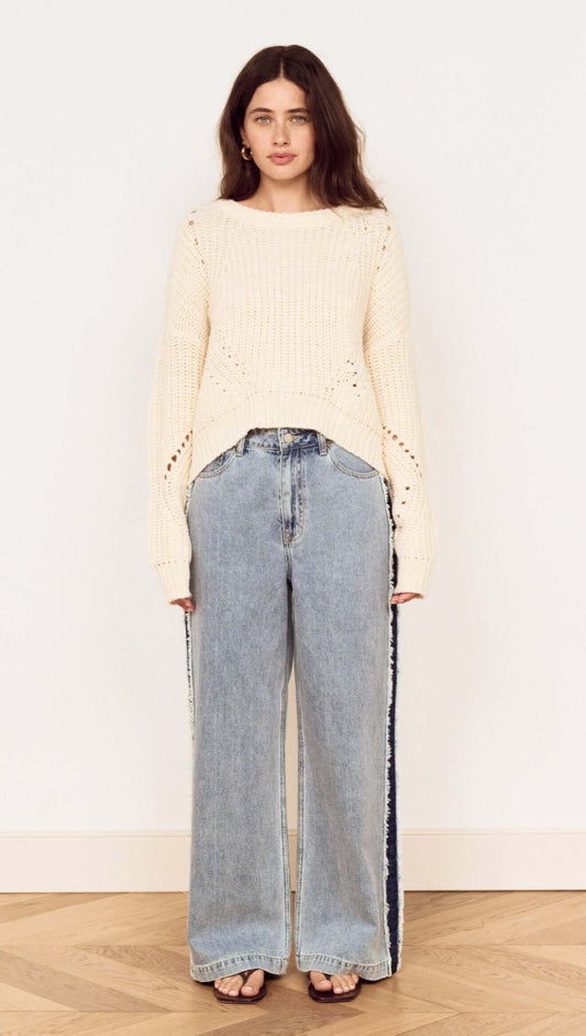 Cream Round Neck Open Knit Jumper styled with wide leg denim jeans against a neutral background.