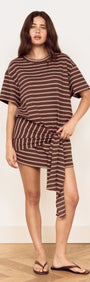 Model wearing Striped Tie Waist Jersey Mini Dress with chocolate stripes and an adjustable tie at the waist.