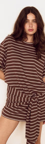 Model wearing Striped Tie Waist Jersey Mini Dress in chocolate stripe print, featuring an oversized tee bodice and fitted mini skirt.