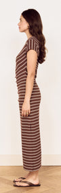 Profile view of a model wearing a Striped Jersey Ruched Midi Dress with chocolate stripe print.