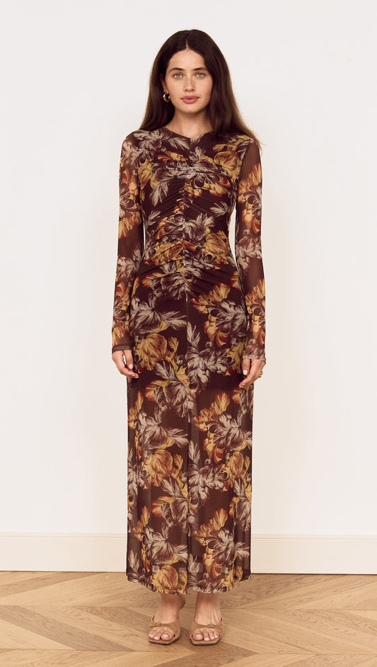 Brown Floral Gathered Mesh Midi Dress on a model, featuring a sheer floral print with long sleeves and a fitted silhouette.