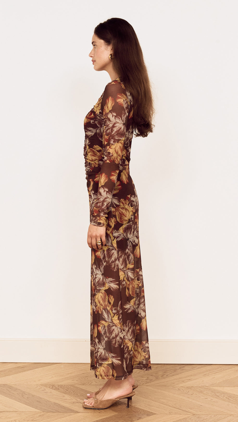 Brown Floral Gathered Mesh Midi Dress shown from the side view, featuring a sheer mesh fabric and oversized floral print.