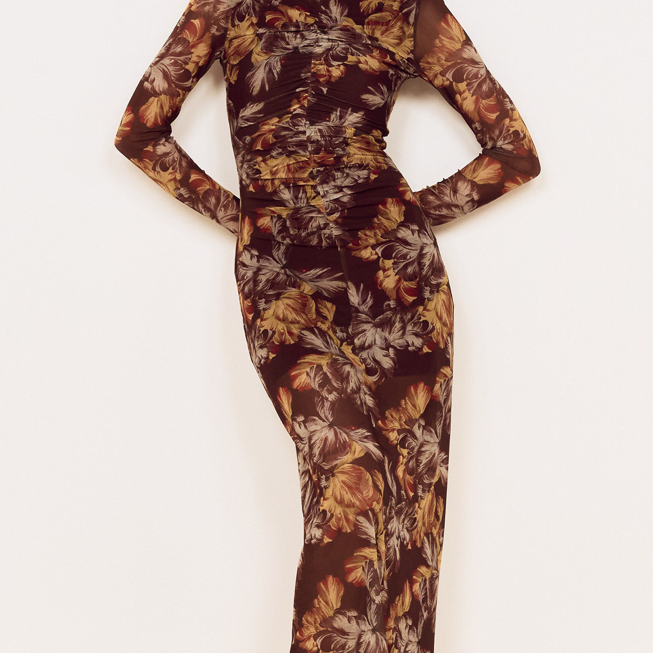Brown Floral Gathered Mesh Midi Dress worn by a model standing against a neutral background, showcasing elegant floral details.