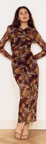 Brown Floral Gathered Mesh Midi Dress worn by a model standing against a neutral background, showcasing elegant floral details.