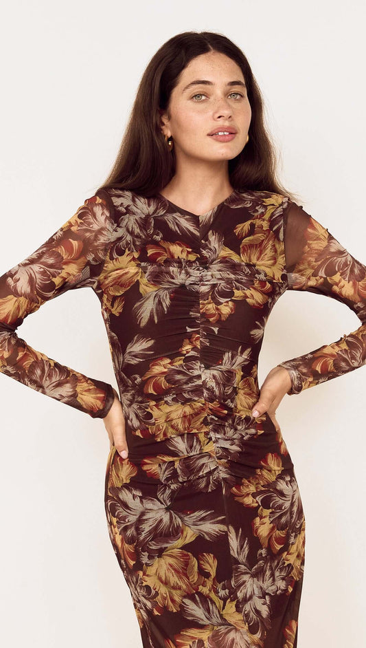 Model wearing a Brown Floral Gathered Mesh Midi Dress with long sleeves and floral print design.