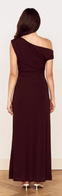 Rear view of a woman wearing a Chocolate One Shoulder Mesh Midi Dress with gathered detailing and fluid silhouette.
