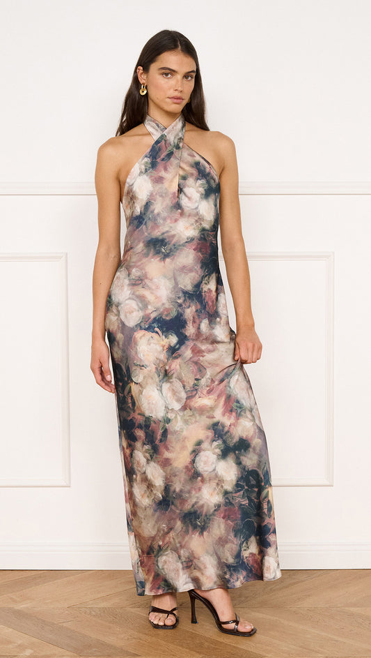 Satin Halter Neck Maxi Dress in Rose Floral worn by a model against a neutral background, showcasing its elegant design.