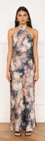 Satin Halter Neck Maxi Dress in Rose Floral worn by model, showcasing a floral design with a halter neckline and maxi silhouette.