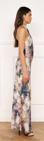 Satin Halter Neck Maxi Dress in Rose Floral worn by a model, showcasing the floral print and side profile design.