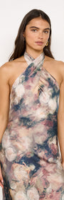 Satin Halter Neck Maxi Dress in Rose Floral worn by model, featuring abstract floral print and crossover halter neckline.
