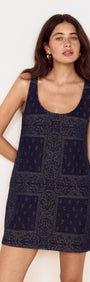 Model wearing Paisley Jacquard Denim Mini Dress featuring a scoop neckline and intricate bandana-style pattern.