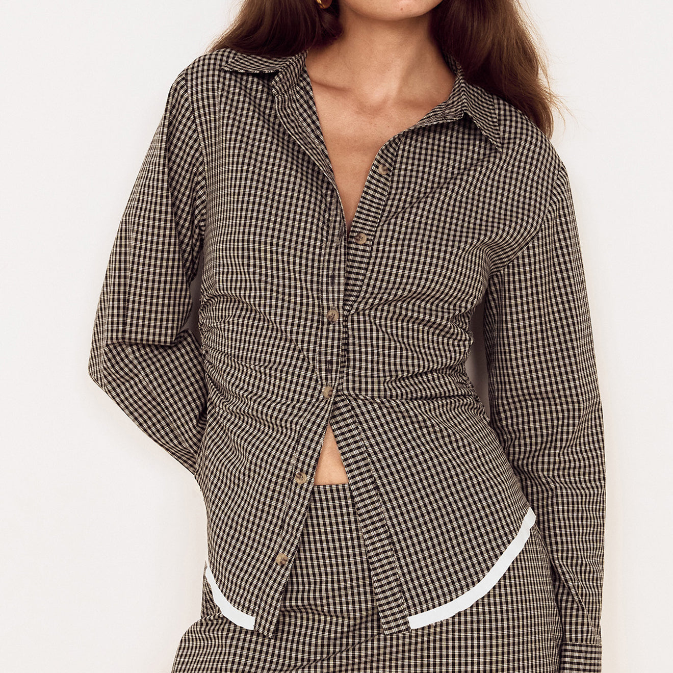Model wearing Contrast Hem Mini Skirt in Grey Check with matching check shirt, showcasing stylish micro-check design.
