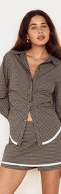 Model wearing Contrast Hem Mini Skirt in Grey Check with matching check shirt, showcasing stylish micro-check design.