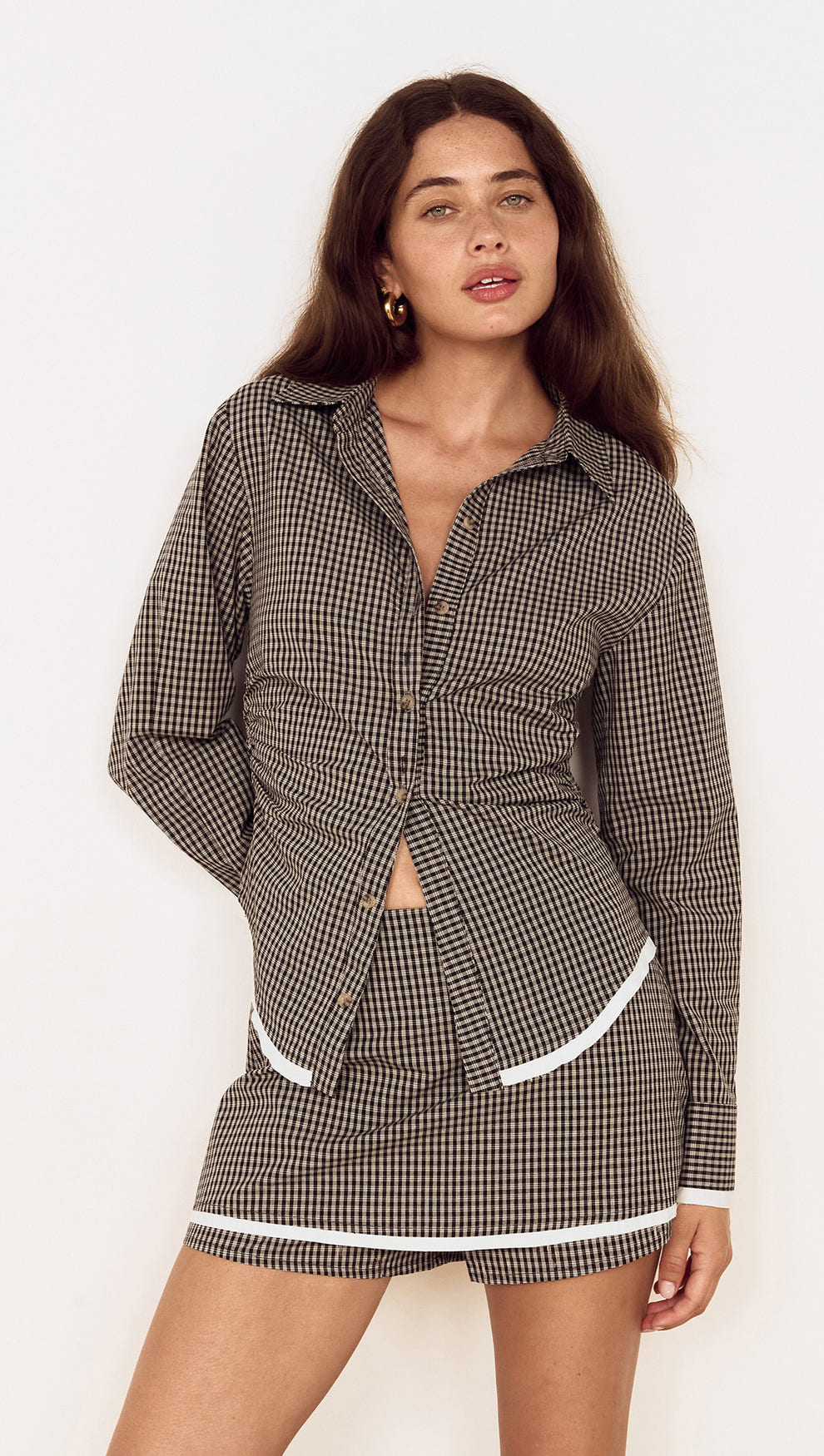 Model wearing Contrast Hem Mini Skirt in Grey Check with matching check shirt, showcasing stylish micro-check design.