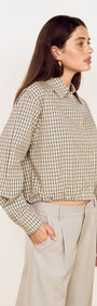 Cotton Bubble Hem Shirt in Blue Check worn with tailored pants, showing a side view and gathered bubble hem design.