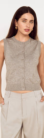 Model wearing Round Neck Knitted Vest in Soft Grey, featuring a button-through front and sleek fitted silhouette.