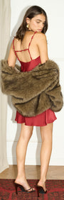 Cowl Neck Bias Mini Dress with Bead Detail in Red, styled with a fur shawl for an elevated evening look.