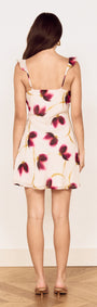 Back view of Floral Ruffle Detail Bias Mini Dress featuring floral print, ruffle detailing, and a mini skirt design.